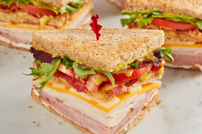 McAlister's Club sandwich with chips and a pickle